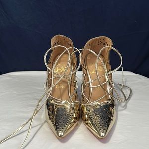A Christian shoes size 7 in gold